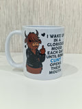 A white ceramic mug featuring a cartoon illustration of a Scottish highland cow in a black leather jacket making a middle finger gesture, next to a humorous quote in black and blue text.
